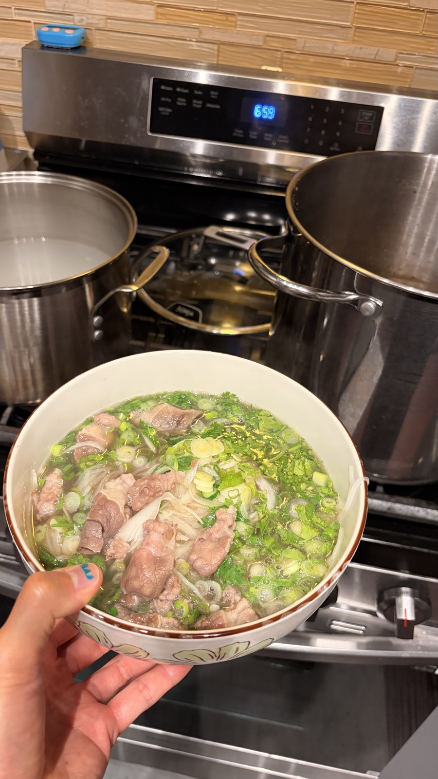 A finished bowl, stockpots still going